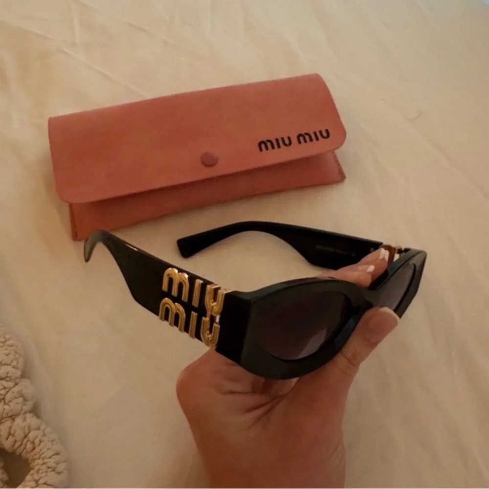 Miu Miu Glossy Black Cat-Eye Sunglasses with Pink Case